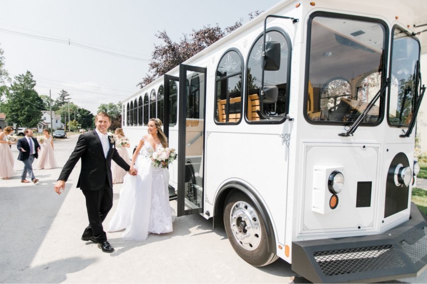 Newlywed couple approaching the trolley